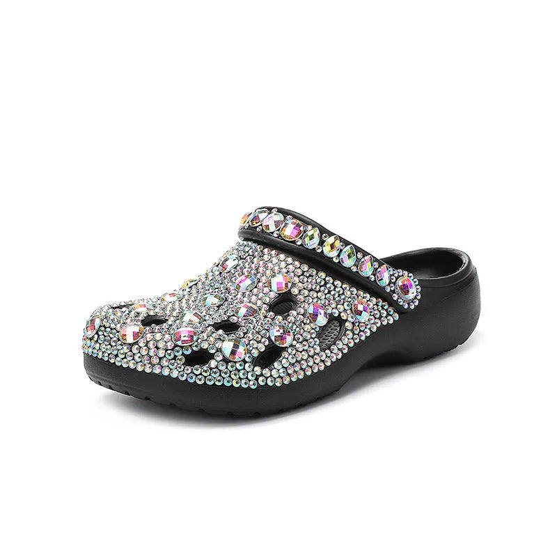 Black women's platform sandals with rhinestone details and a perforated upper on an EVA sole.