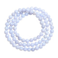 Blue striped agate bead bracelet with Ruyi charm on a wrist.