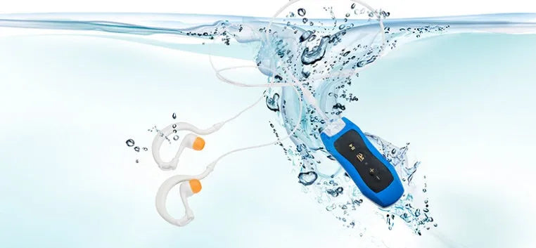 Waterproof Bluetooth mini headset MP3 player in various colours, showing compact size.