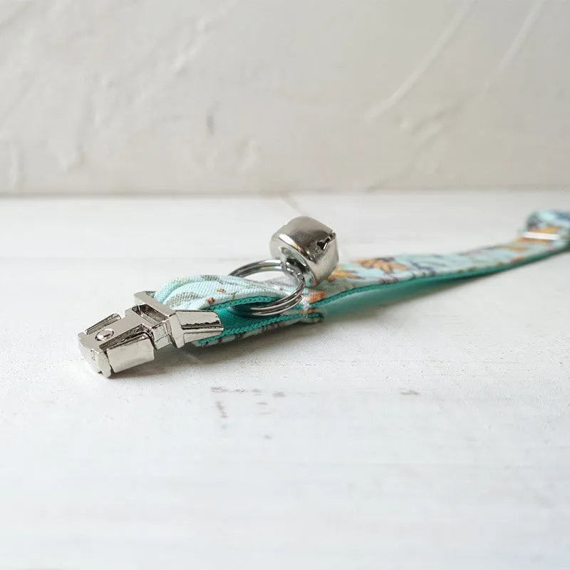 Green adjustable pet collar made from cloth and webbing, available in sizes L and S