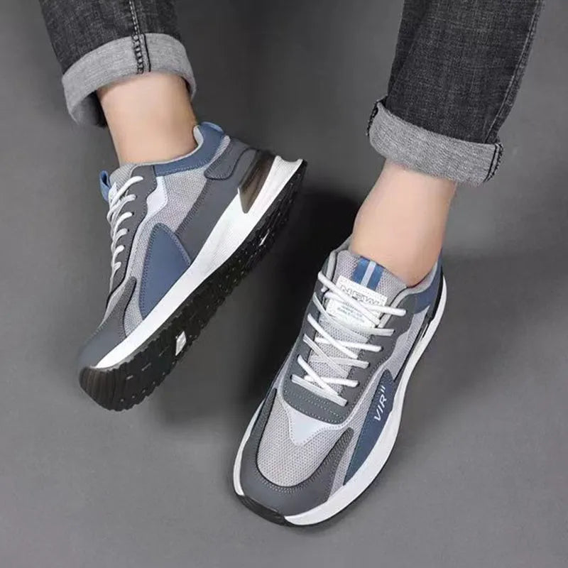 Men's colour block mesh sneakers in black, grey, or white with lace-up design and round toe.