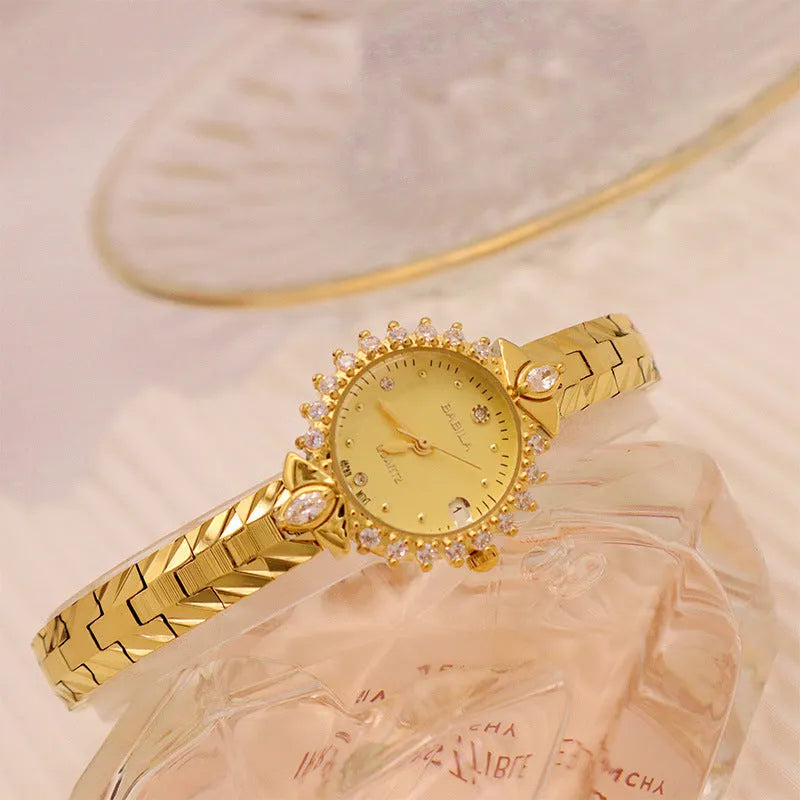 Women's vintage quartz watch with gold face and diamond embossed bracelet, slim 6mm design on a neutral background