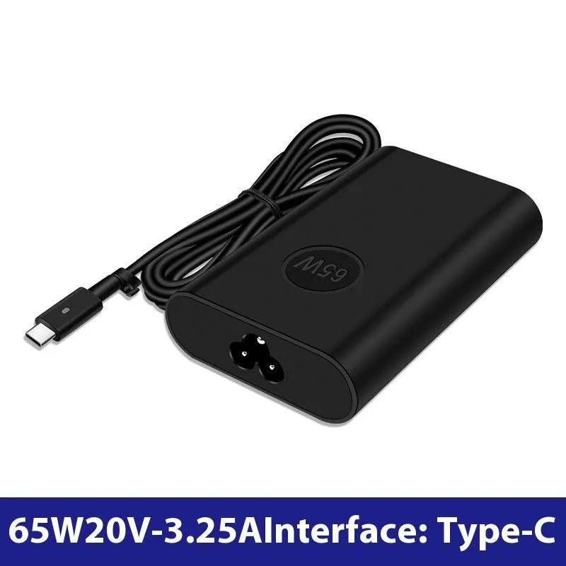 Black 65W USB-C laptop power adapter with UK plug and international travel adapters