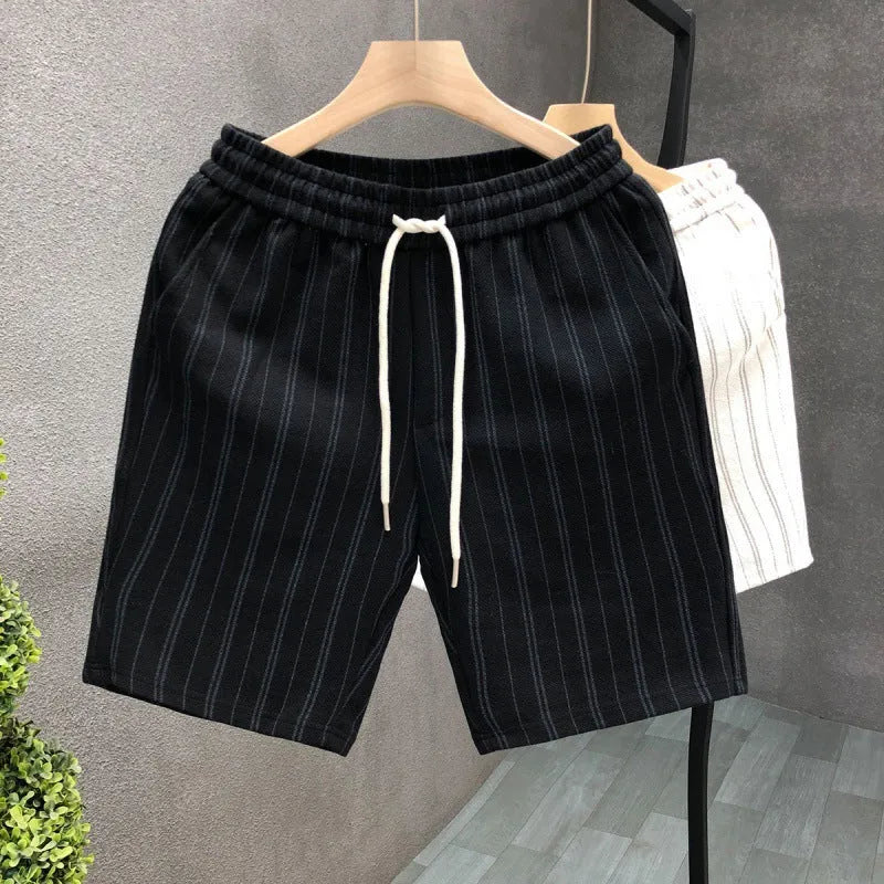 Men's black and white striped casual shorts with straight cut and ankle banded hem