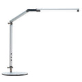 Aluminium LED desk lamp with a folding clip, remote control, and black finish on a desk.