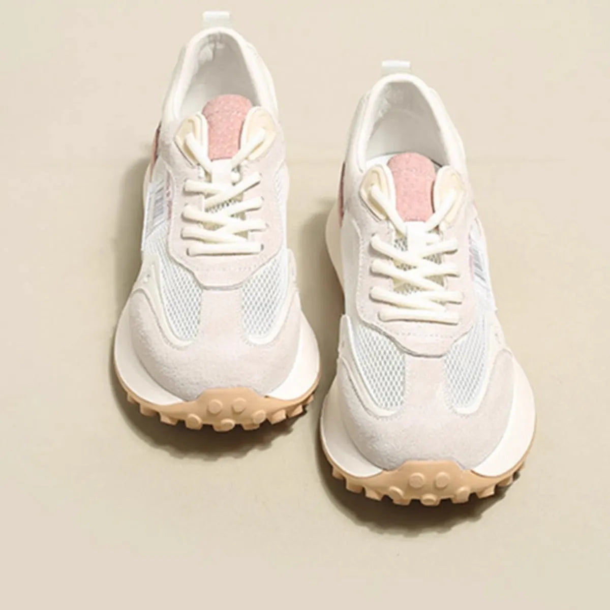 Women's casual retro sneaker in grey or pink with low-top design and round toe