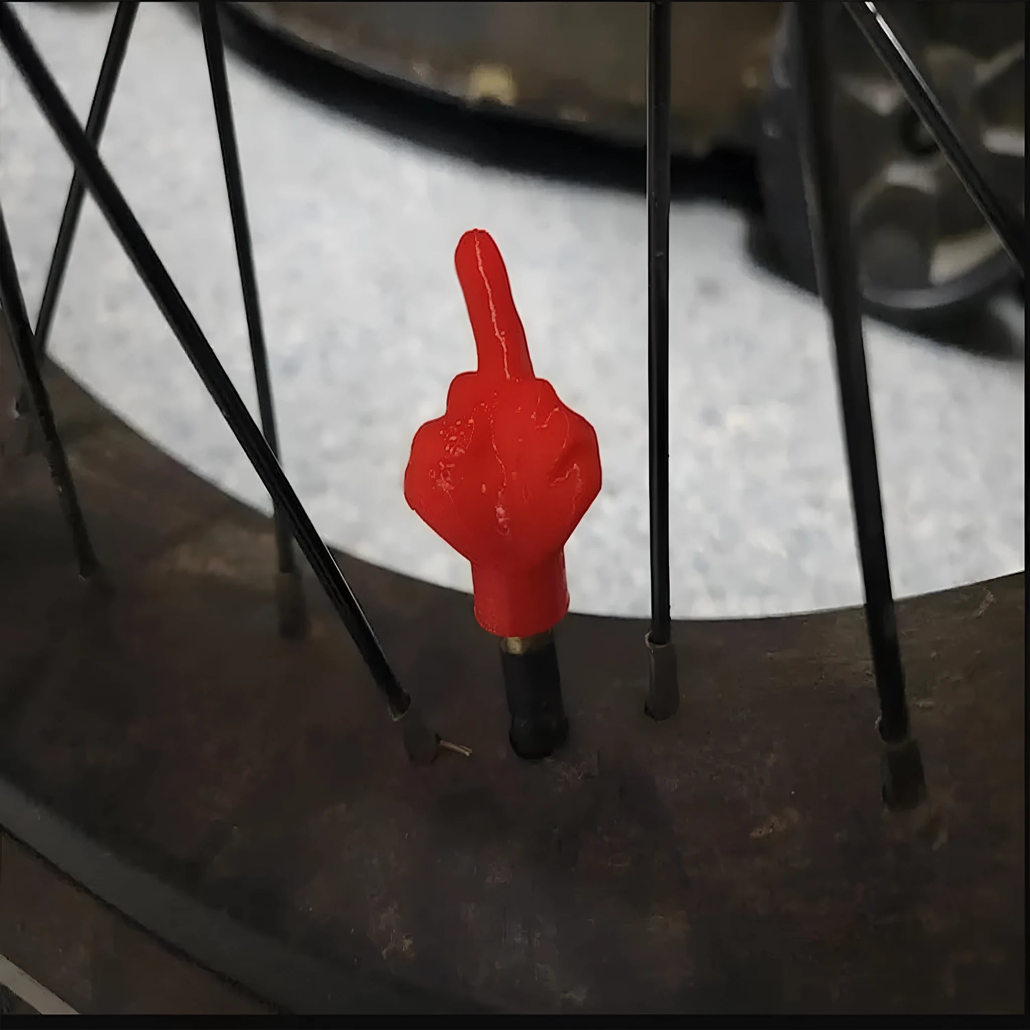 Eight latex car tyre valve caps, four black and four skin colour, for dust protection.