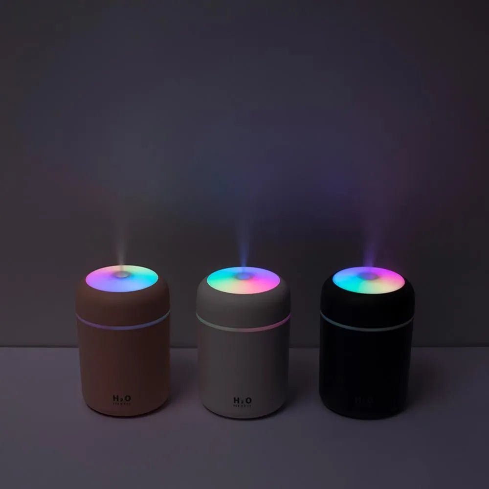 USB-powered mini humidifier with colourful LED lights in pink, white, or navy blue colour options