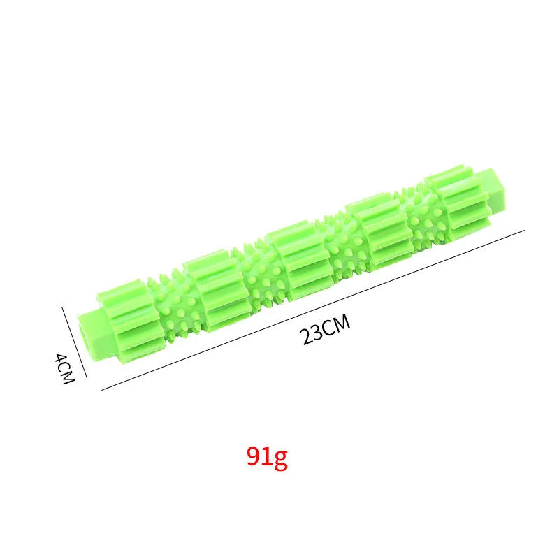Green and orange rubber dog chew toy with treat dispensing opening and textured cleaning surfaces