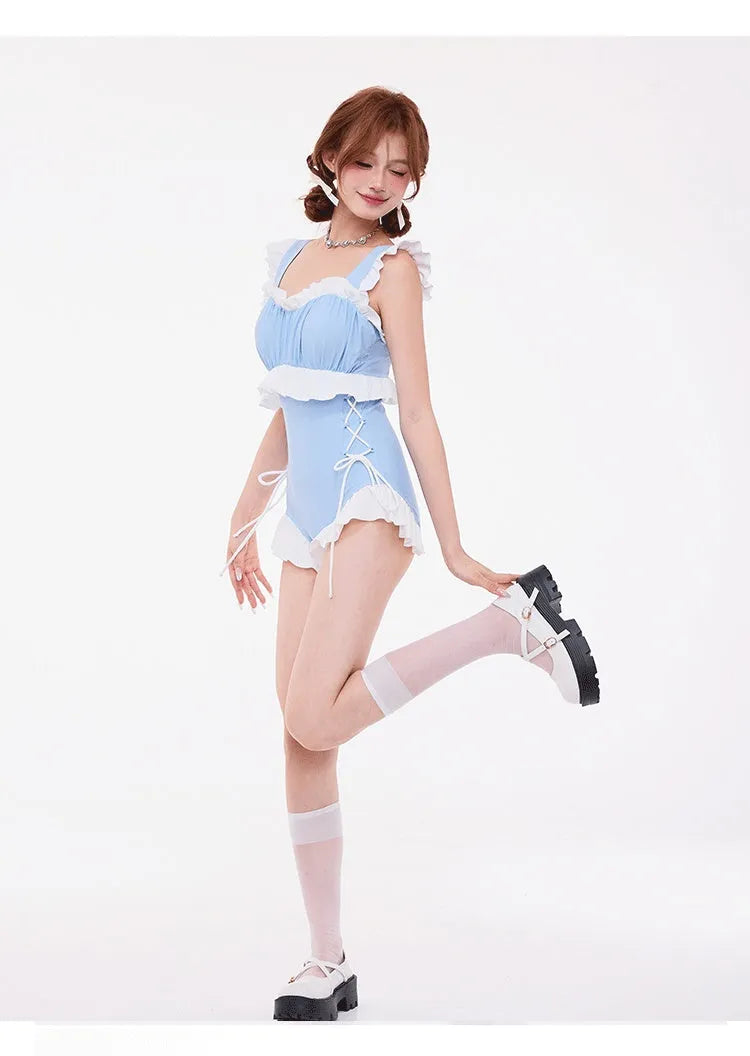 Light blue women's one-piece swimsuit with lace trim on chest, high waist, and backless design.