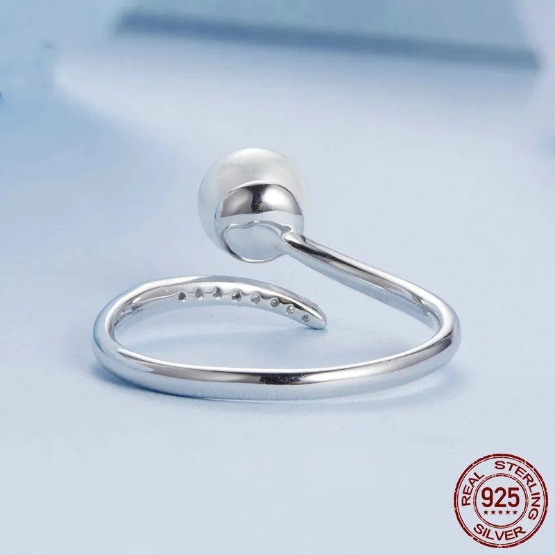 Adjustable S925 sterling silver ring with shell pearls in open loop design