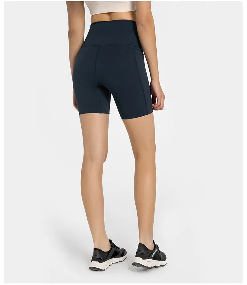 Women's solid colour mid-length sports shorts with super stretch cotton blend fabric.