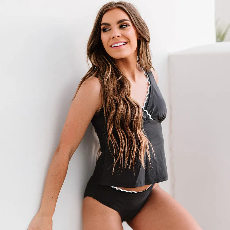 Black women's nylon bikini swimsuit showing sleeveless design and solid colour