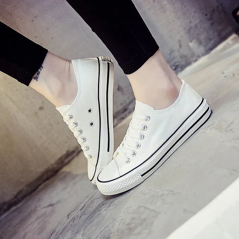 Women's solid colour canvas casual shoes in black, white black, white red and all black colour options.