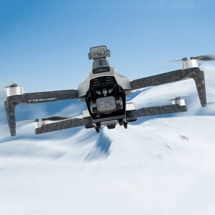 White foldable quadcopter drone with camera, remote control, flight batteries, and shoulder bag laid out.