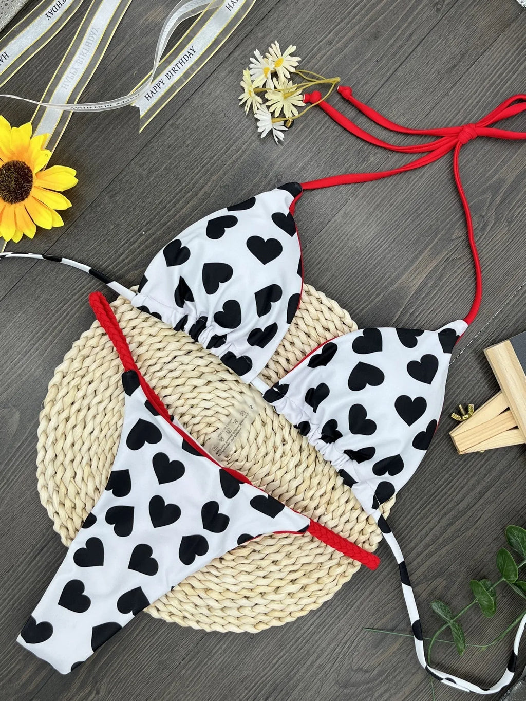 Heart print swimsuit set with backless design and split leg styling in nylon fabric