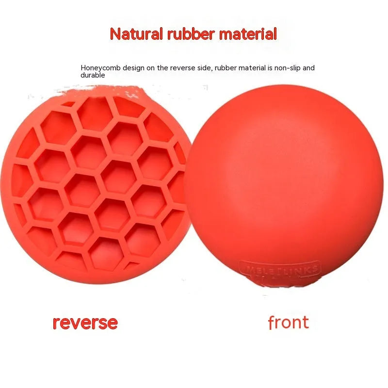 Orange natural rubber golf strength training mat with centre of gravity markings on a flat surface.