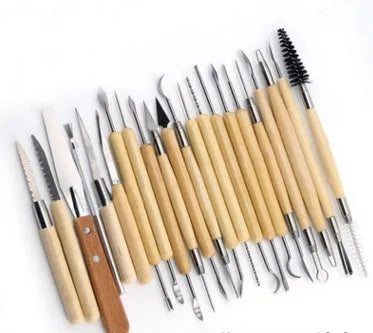 27-piece brown pottery clay tool set with stainless steel, wood, and plastic instruments in a roll bag.