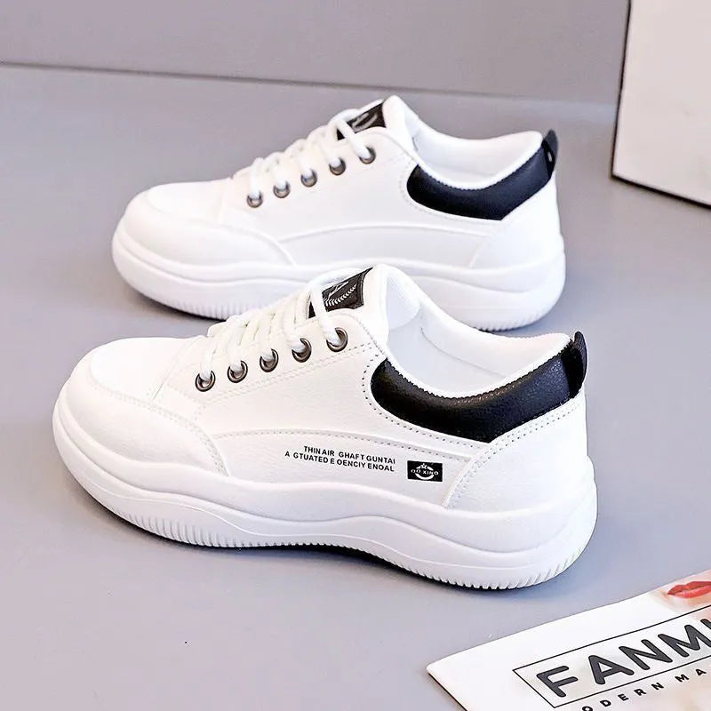 Women's white Korean-style lace-up shoes with cross-strap detailing and flat mid heel