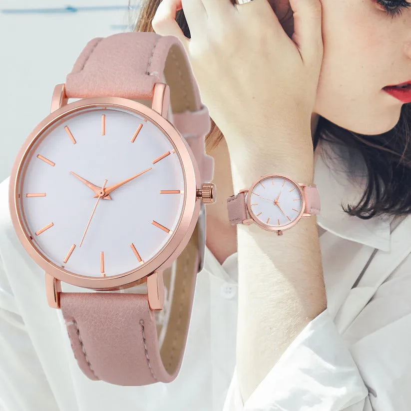 Square-faced quartz analogue watch with a PU leather strap on a wrist