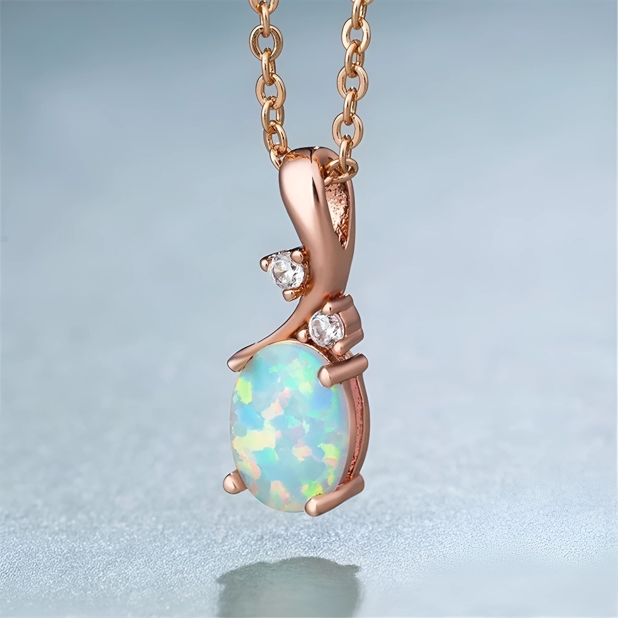 Water drop shaped opal pendant necklace with adjustable chain in white or rose gold finish