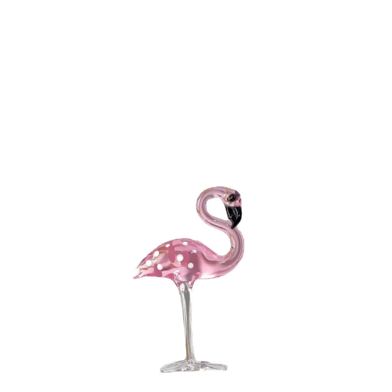 Pink crystal flamingo decorative ornament on a table, modern minimalist style.