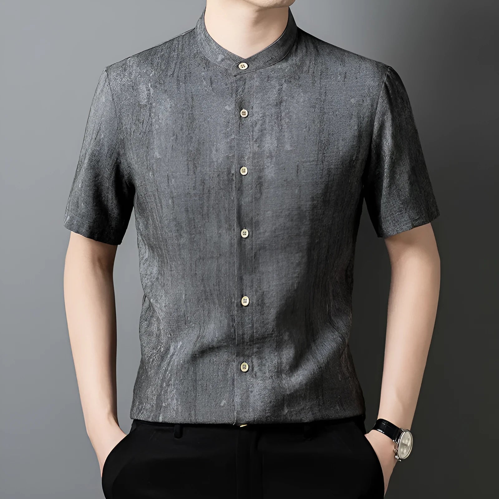 Men's loose grey cardigan shirt with stand collar and short sleeves on a hanger