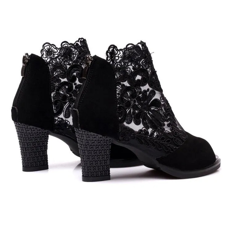 Women's black lace gladiator sandals with square heels and zip closure showing flower detailing