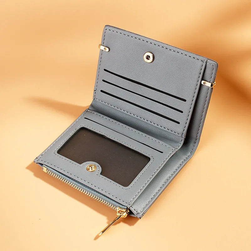 Ladies wallet with zipper closure showing multiple card slots and compartments in PU leather