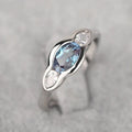 Geometric ellipse women's ring with inlaid zircon stones in white gold colour