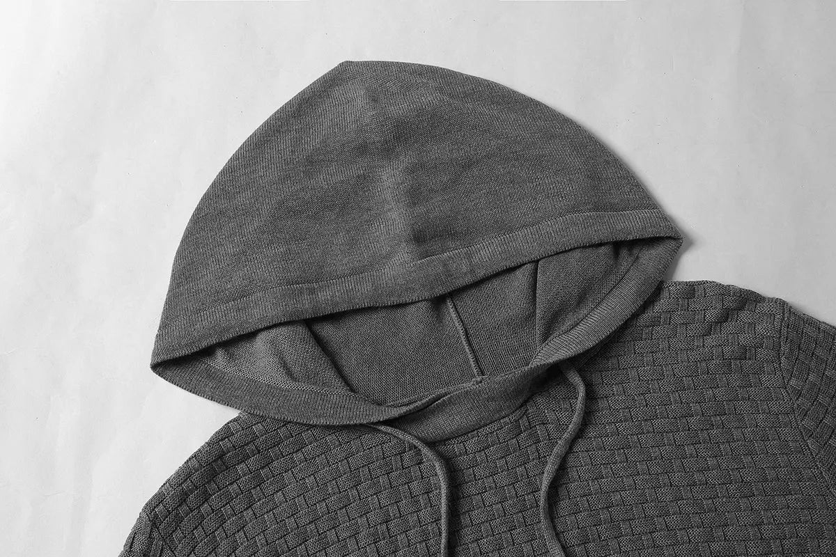 Men's black cotton-polyester hooded sweatshirt on a hanger, size label visible.