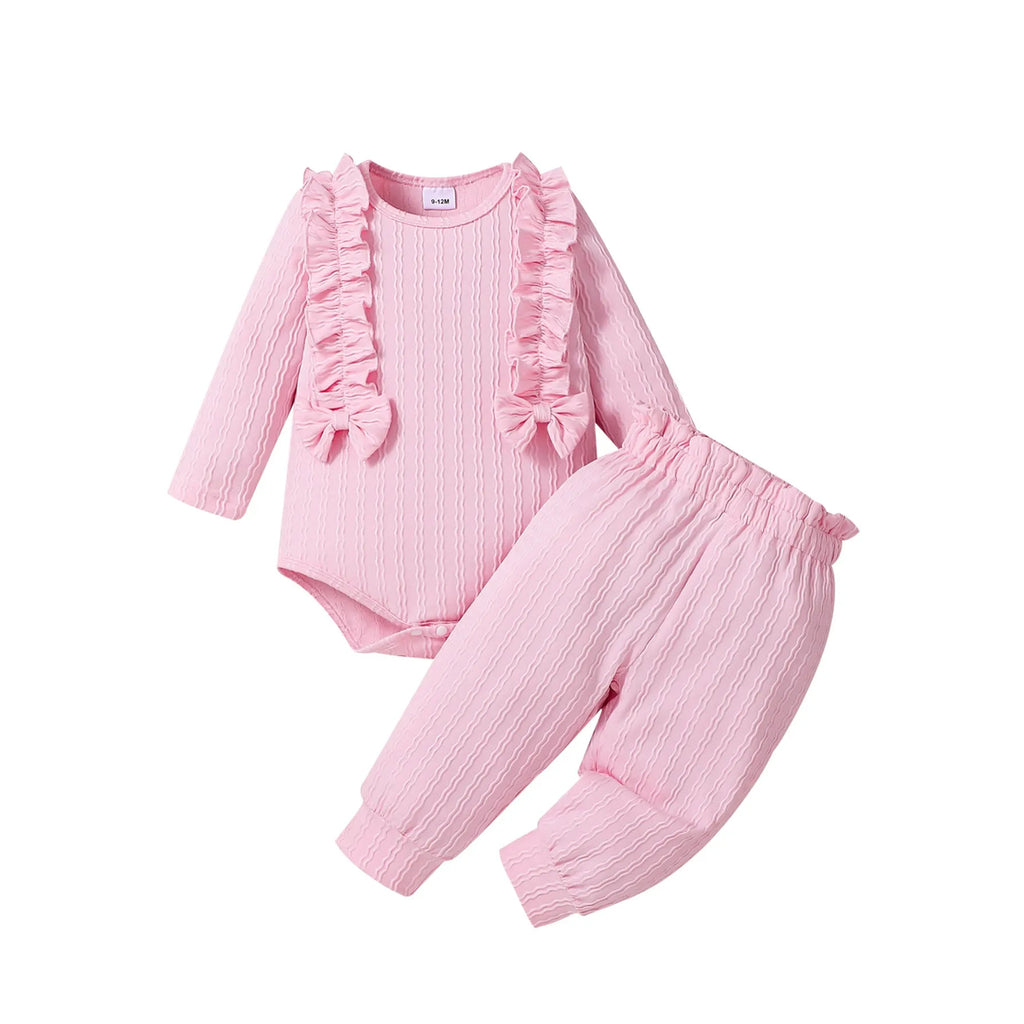 Pink baby girl three-piece set with ribbed frill long sleeve romper, pants, and matching headscarf on white background