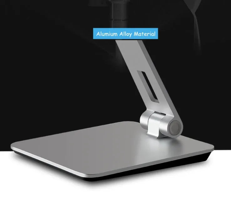Black folding aluminium desktop stand holding a tablet at an angle, showing 360° rotation and silicone grips.