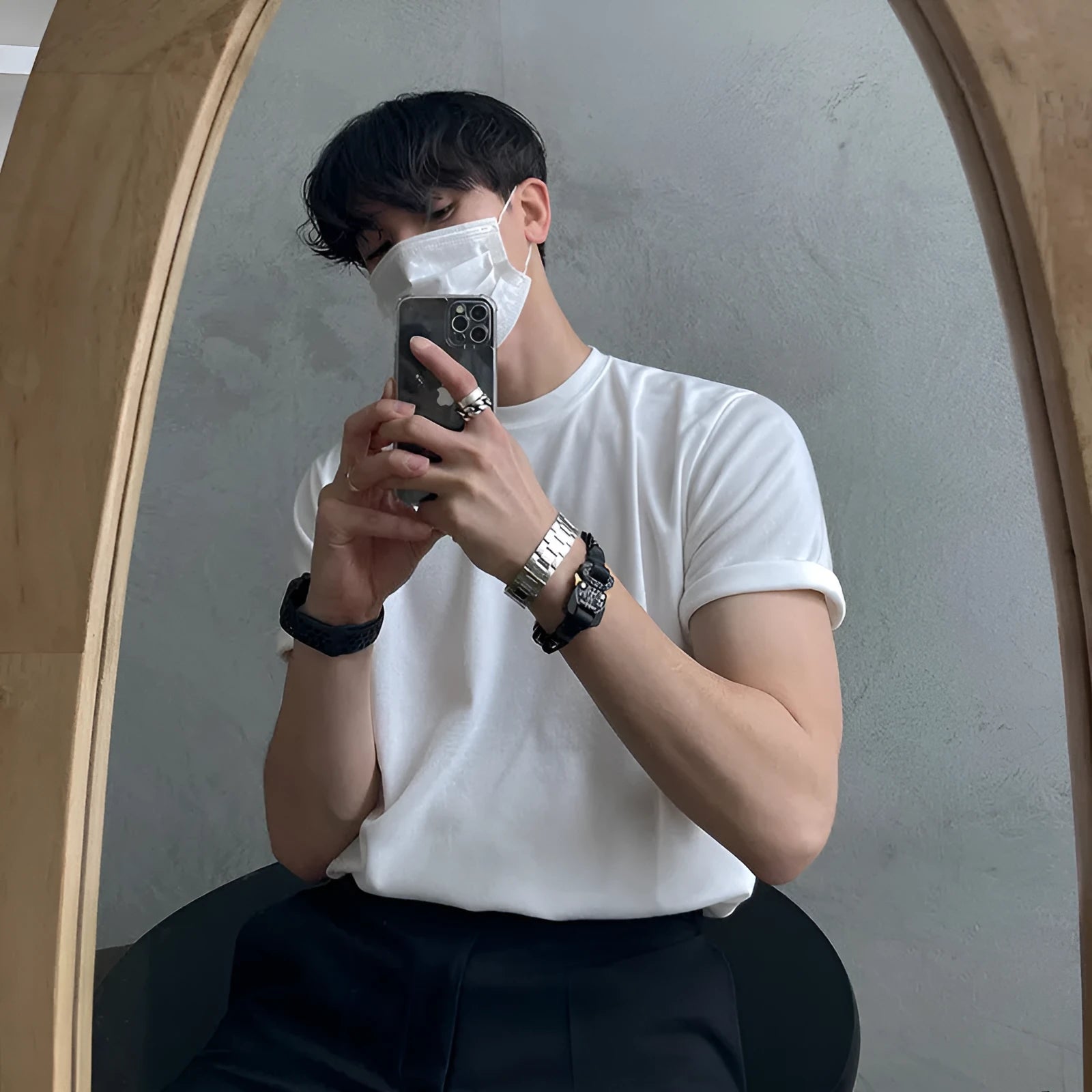 Men's slim fit cotton half sleeve t-shirt in black, showing round neck and regular sleeve design.