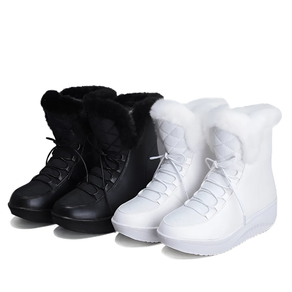 Black women's lace-up winter boots with a platform sole on a white background