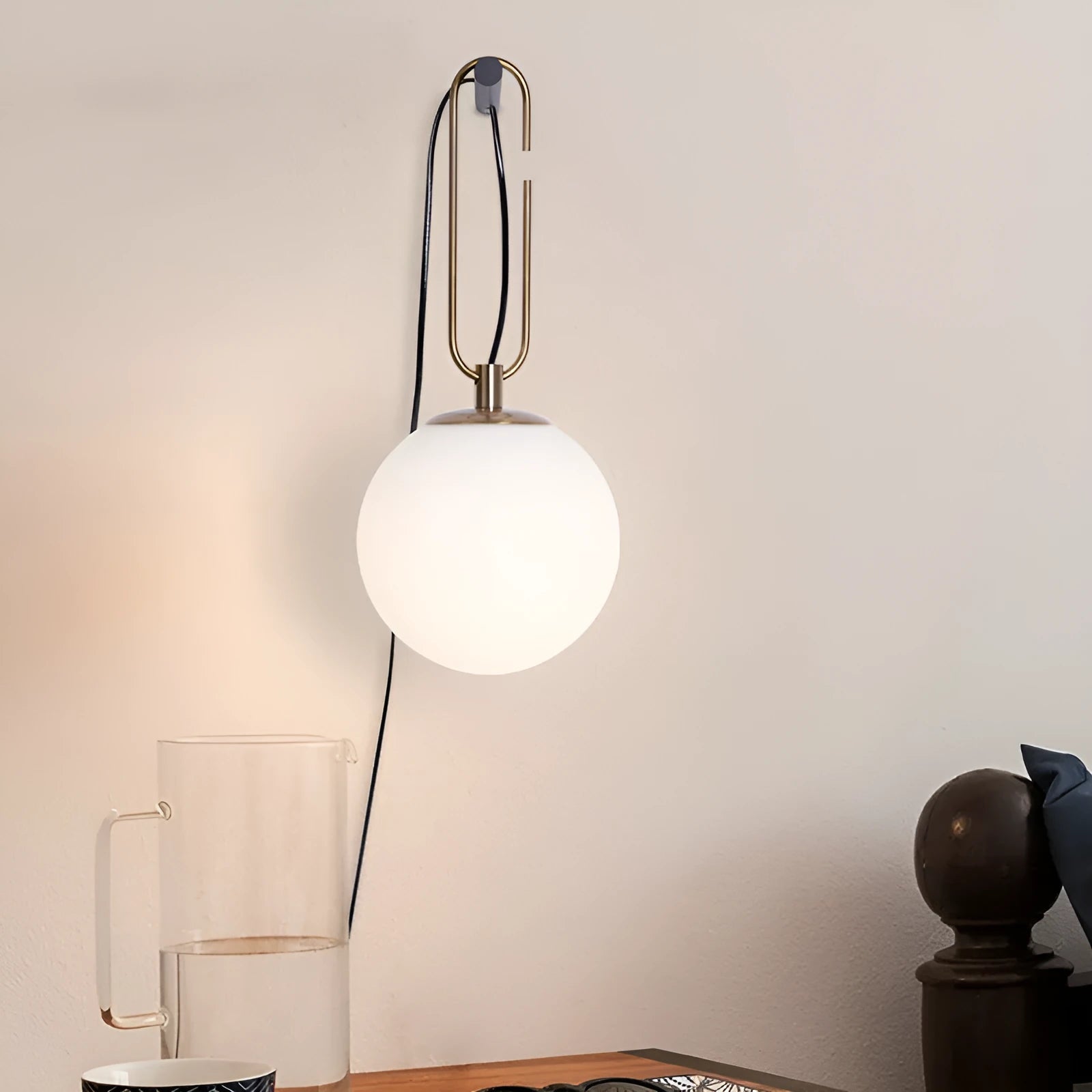 Nordic modern glass wall lamp mounted on a wall, showcasing its simple design and translucent glass shade.