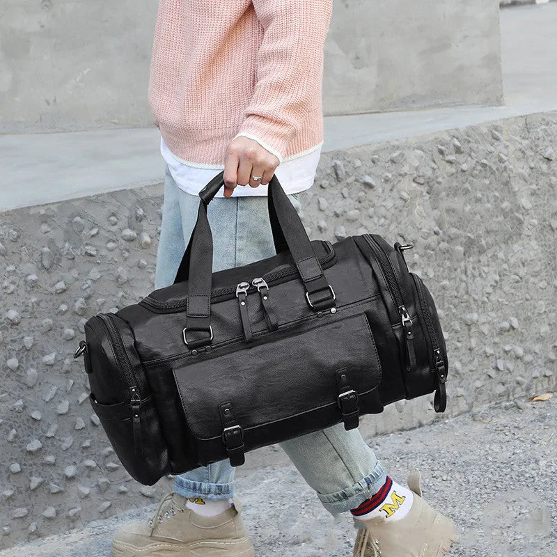 Large black PU travel bag with separate shoe compartment, dimensions 52cm by 19cm by 27cm