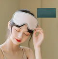 Pink and green portable Eye SPA mask with steam heat and vibration massage functions.
