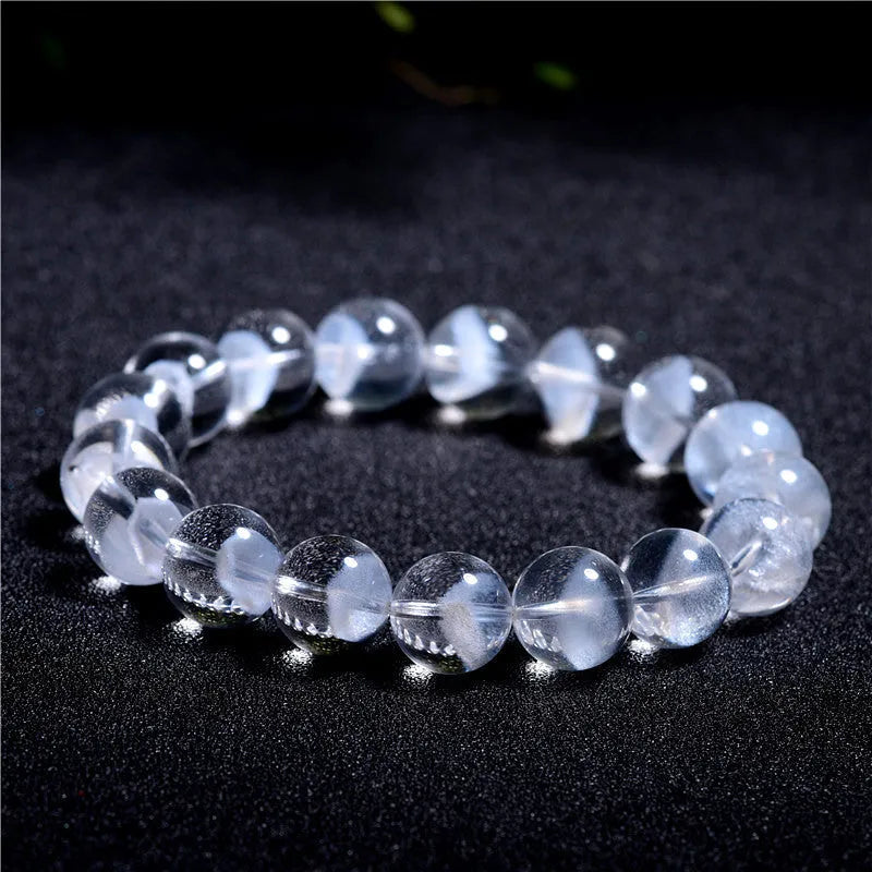 Women's white crystal pyramid bracelet with Ruyi charm in natural ghost colour showing geometric beads