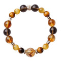 Tiger-eye crystal bracelet with Jinba symbol and geometric tower design in natural yellow