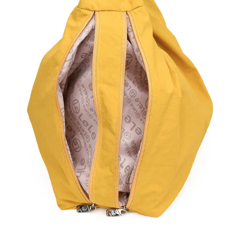 Women's heart-shaped nylon underarm bag in black, blue, khaki, and yellow colour options showing large capacity design