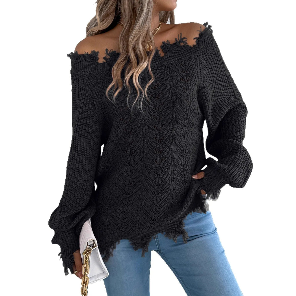 White hollow-out long sleeve pullover sweater with an off-the-shoulder neckline on a hanger.