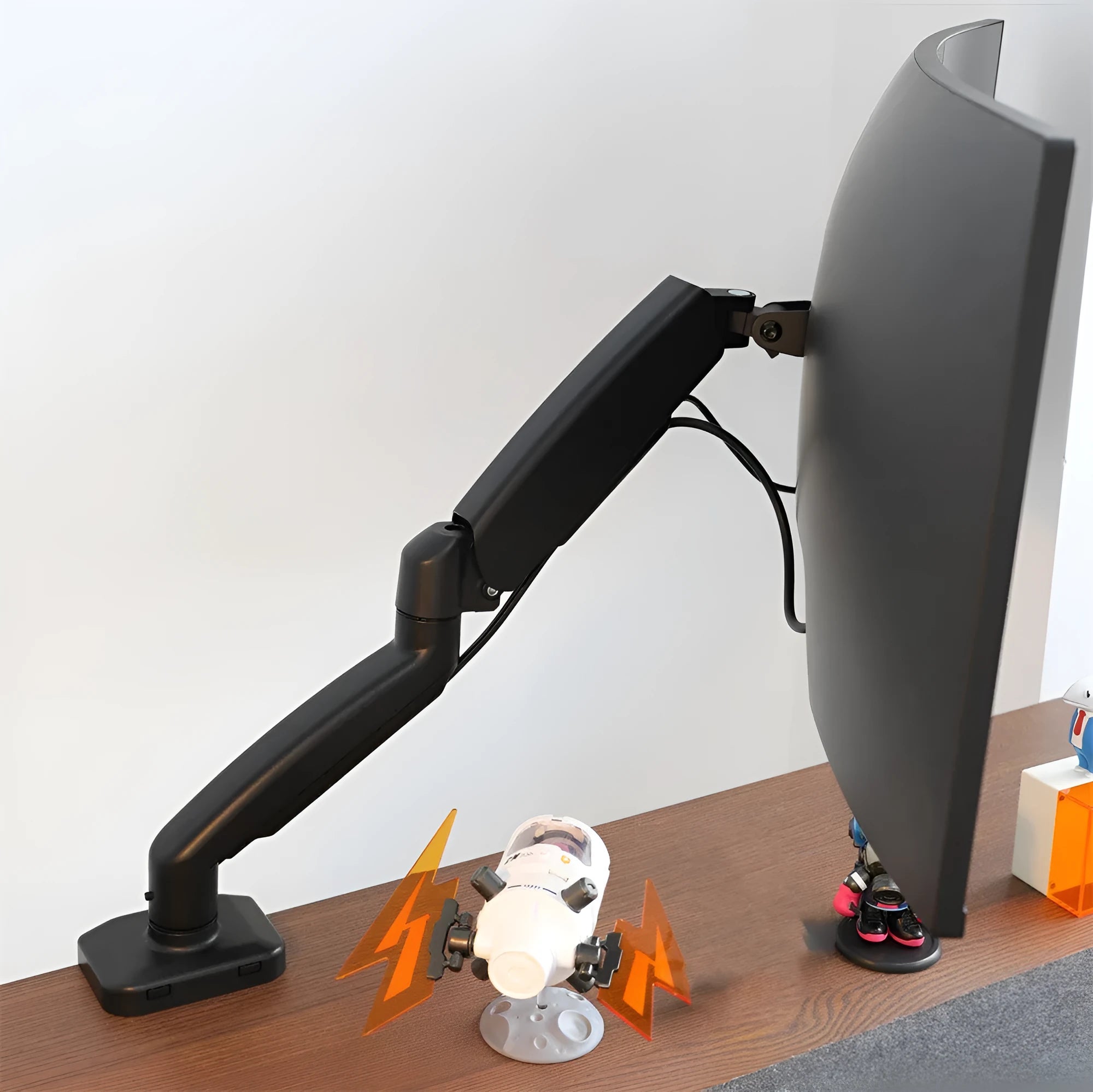 Black LCD screen rotating telescopic bracket elevated on a desk next to a monitor