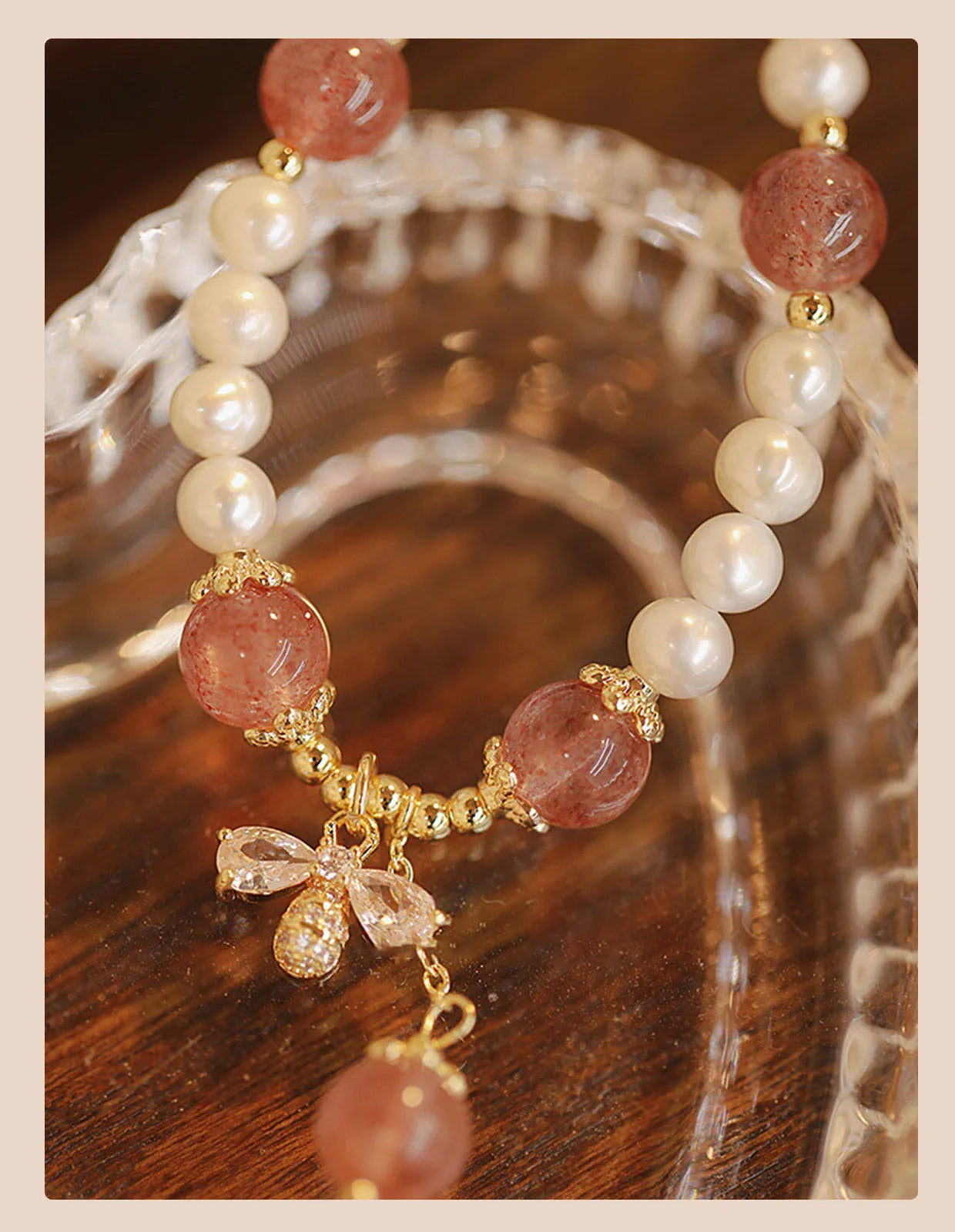 Strawberry quartz colour crystal bracelet with bow and stringed pearls.