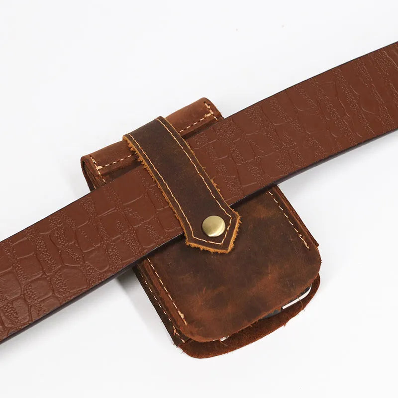 Crazy horse leather key case in dark brown, 7cm by 11.5cm, resting on a surface