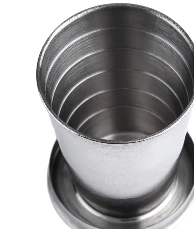 Silver stainless steel collapsible travel cup folded small on a key ring for outdoor use