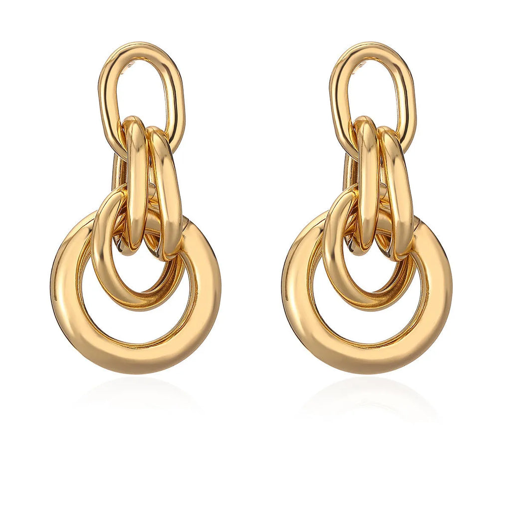 A pair of gold-coloured geometric earrings with an irregular, high-profile wild design for women.