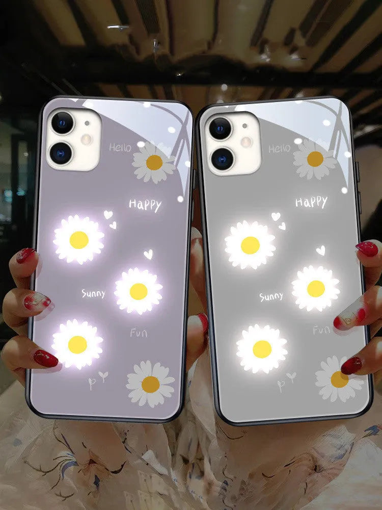 White iPhone case with painted daisy design and illuminated voice-activated colour light.