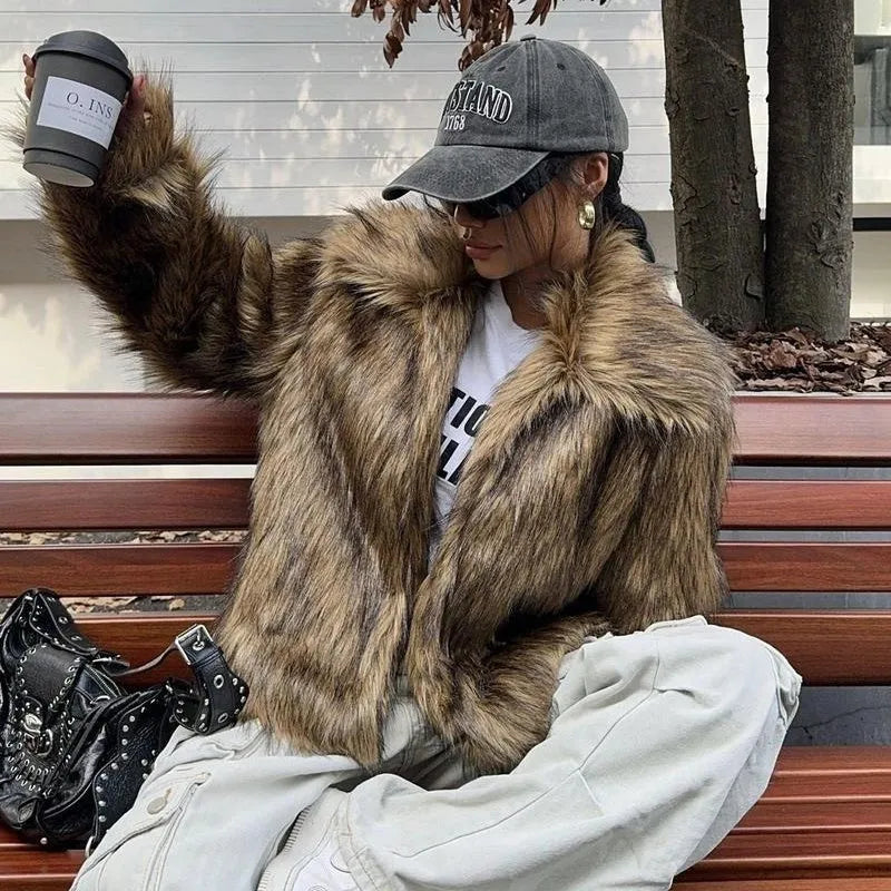 Short black artificial fur coat with a large fur collar, shown on a model.