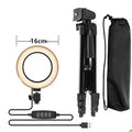 Adjustable aluminium phone stand extended to maximum height with smartphone mounted